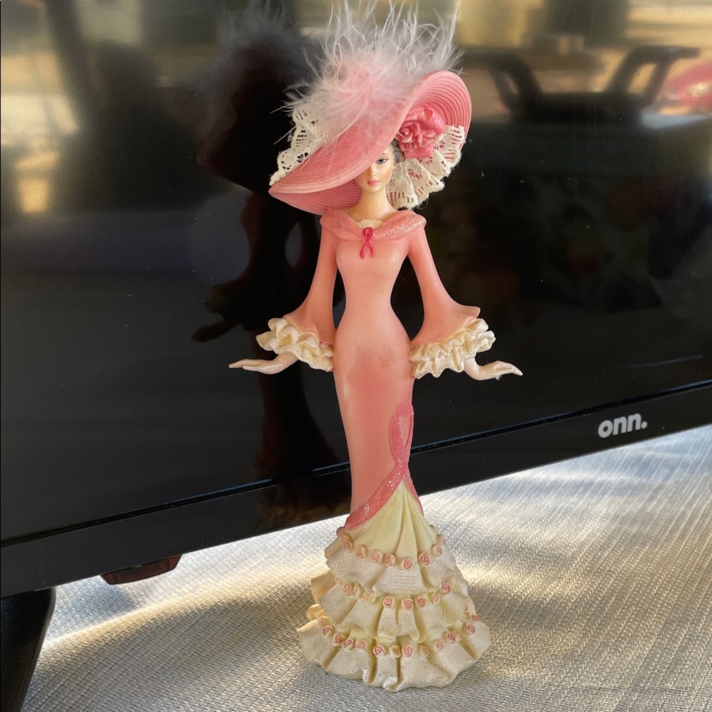 On Running Pink and Cream Lady Figurine